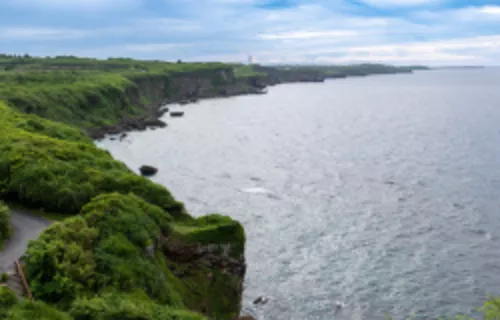 Dramatic cliffs on Irabu Island with stunning emerald green waters